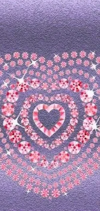 This phone wallpaper is a stunning display of a heart made out of flowers, pink diamonds, candy, fairy circles and glitter background