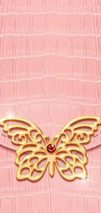 This live wallpaper for smartphones showcases a digital rendering of a beautiful pink purse adorning a gold butterfly, boasting exquisite texture detail