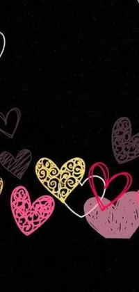Looking for a stunning phone wallpaper that's both romantic and trendy? Look no further than the "Falling Hearts Live Wallpaper"! Designed by Anna Findlay, this colorful wallpaper features a plethora of hearts in various hues cascading down a black background