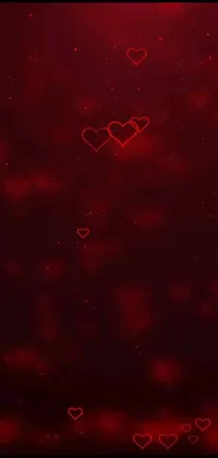 This phone live wallpaper boasts a vivid display of colored hearts against a dark and smoky background