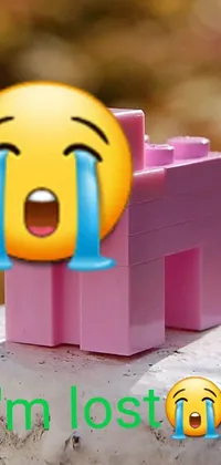 Add some relevant keywords:
This fun and colorful live wallpaper features a yellow smiley face sitting on a pink bench over a background maze made of colorful Lego bricks