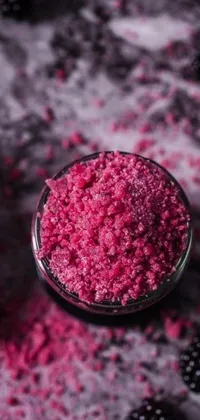 This phone live wallpaper showcases a vibrant raspberry scrub in a bowl on a table using a stippling technique
