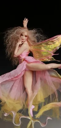 This live wallpaper features a close-up of a figurine of a woman in a pink dress, rainbow wings and a playful pose