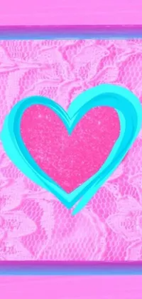 This lively phone live wallpaper features a hot pink and cyan painted heart on a soft pink glitter background with delicate lace corners