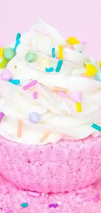 This live wallpaper features a delightful pink cupcake with white frosting and colorful sprinkles that will make your phone screen look absolutely delicious