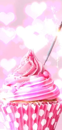 This pink cupcake with a sparkler phone live wallpaper brings joy and color to your screen