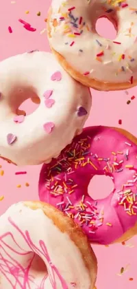 Looking for a phone wallpaper that's both playful and sweet? Check out this live wallpaper featuring colorful donuts with different sprinkles on a bright pink background! Designed with a whimsical touch, this wallpaper is inspired by girly and fun elements that will appeal to anyone who loves fashion, beauty, and desserts