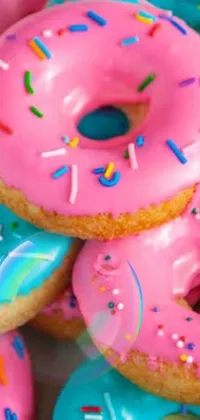 Get ready to make your phone screen a delicious display with this stunning live wallpaper! Featuring a photorealistic painting of mouthwatering pink and blue donuts with sprinkles, this trendy design is made of colorful lollypops