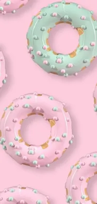 This unique Phone Live Wallpaper showcases a mesmerizing assortment of donuts resting on a stunning pink surface