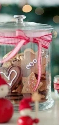 This charming live phone wallpaper features a glass jar bursting with delectable cookies atop a rustic wooden table