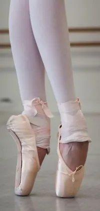 This phone live wallpaper showcases a pair of beautifully designed ballet shoes in pink