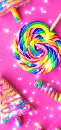 This lively phone wallpaper is adorned with sweet and colorful lollipops arranged on top of a vibrant pink background