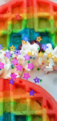 This phone live wallpaper features a colorful Lisa Frank-inspired close-up of a waffle with marshmallows, decorated with stars, glittery sparkles, and rainbow ophanims