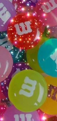 Add a pop of color and retro flair to your phone with the M&M's Balloon Live Wallpaper