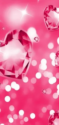This phone live wallpaper features charming pink hearts that float against a beautiful background bokeh, complemented by large diamonds and gemstones for eyes creating a stunning visual effect