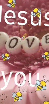 This phone live wallpaper features a stunning pink flower with the words "Jesus loves you" written in elegant script