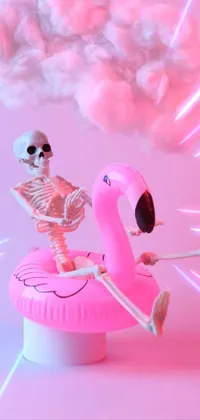 This live wallpaper features a magical and eerie scene with a posable PVC skeleton riding on a pink flamingo