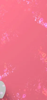 This live wallpaper for your phone features a generative heart-shaped object on top of a serene pink surface