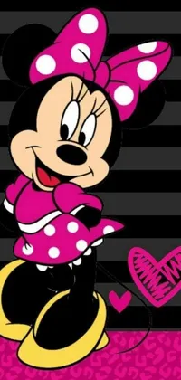 This phone live wallpaper features beloved Disney character Minnie Mouse seated on a soft pink blanket with a picture frame beside her