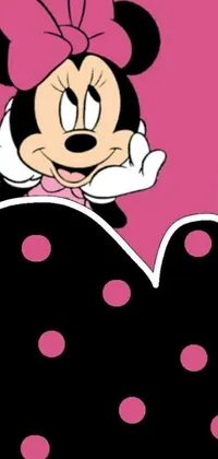This live phone wallpaper features a playful design of Minnie Mouse with polka dots against a pink and black pop art inspired background