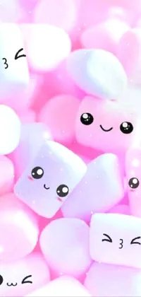 This delightful phone live wallpaper features a colorful pile of marshmallows with cute faces on them, set against a playful and whimsical background
