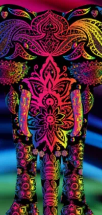 This phone live wallpaper features a neon elephant with intricate tattoos and Indian patterns on a colorful and psychedelic background