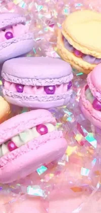 This charming live wallpaper for phones features a stunning close-up of a neatly arranged plate of macarons on a table