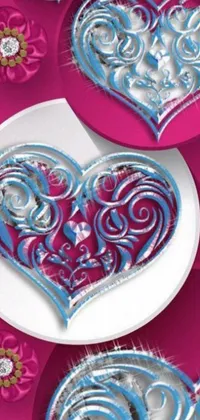 This stunning phone live wallpaper showcases a beautiful white plate topped with delicious blue and pink heart shaped cookies
