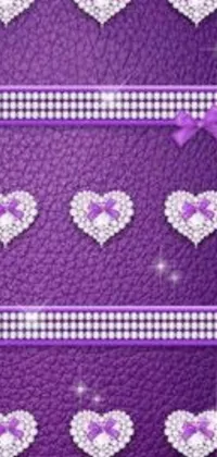 Looking for a stylish and glamorous live phone wallpaper? Check out this stunning design featuring a collection of dazzling hearts set against a vibrant purple background