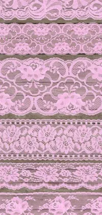 This exquisite phone live wallpaper is a digital rendering of a pink lace fabric texture, complete with a delicate lace pattern and interwoven ribbons