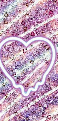 This phone live wallpaper features a vividly detailed icy blue heart on a deep purple glittery background