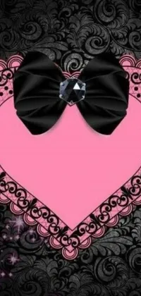 This Live Phone Wallpaper features a stunning pink heart with a black bow in the center for a chic and romantic touch