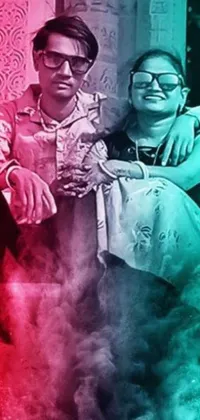 This vibrant phone live wallpaper features a stunning art piece depicting a loving couple surrounded by brightly colored smoke in shades of red, white, blue, and black