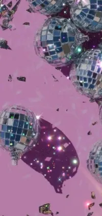 This dynamic phone live wallpaper features disco balls floating in a pink sky over a composition of broken mirrors, offering a mesmerizing and aesthetic visual experience