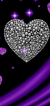 Experience the stunning beauty of this live phone wallpaper featuring a purple heart encrusted with diamonds on a chic black backdrop