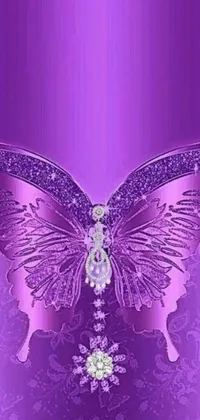 This phone wallpaper showcases a close up of a butterfly on a stunning purple background, adorned with jewels for an extra touch of beauty