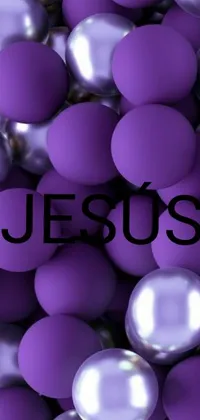 This phone live wallpaper boasts a stunning purple ball design featuring the word "Jesus" on each ball in white script