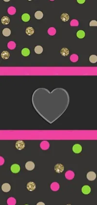 This phone live wallpaper displays a heart silhouette on a black background that has pink and green dots, and comes with a picture