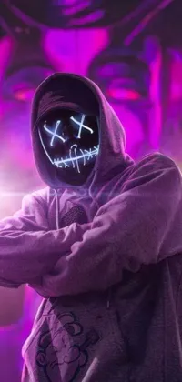 This phone live wallpaper features a man wearing a dark hoodie and a neon mask with purple LED eyes