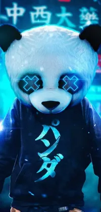 This live phone wallpaper features a close up of a cute panda bear donning a cozy hoodie