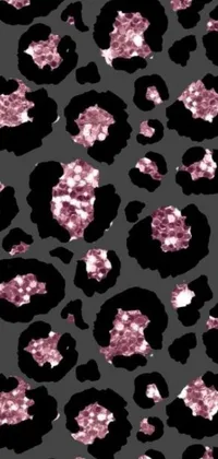 Be bold and add some fierce style to your phone screen with this black and pink leopard print live wallpaper
