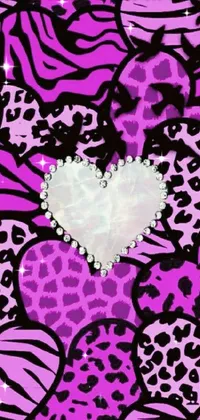 This live wallpaper features a pink and black leopard print with a white heart in the center, animated with sparkling effects