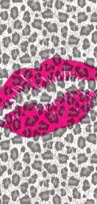 This stunning live phone wallpaper features a pink lipstick close up on a trendy leopard print background