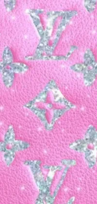 This phone live wallpaper features a beautiful pink background with silver stars to create a charming and enchanting design