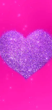 This phone live wallpaper is a beautiful digital rendering of a purple glitter heart set against a bright pink background