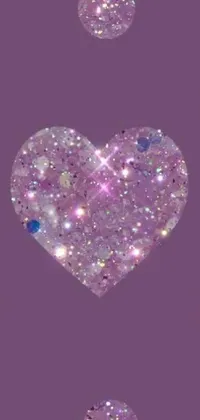 Add a touch of sparkle to your phone with this vibrant purple live wallpaper featuring glitter hearts