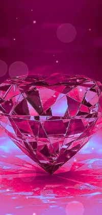 This lively phone wallpaper displays a magnificent pink diamond on a glass-cast heart-shaped table