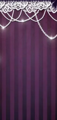 This live wallpaper features a stunning purple curtain with a heart-shaped gemstone hanging from it, surrounded by delicate vector art