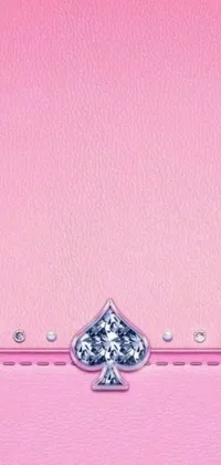 This lovely phone live wallpaper showcases a pink case adorned with two hearts, a large LV logo, diamond texture, chrome hearts, and glittering diamonds