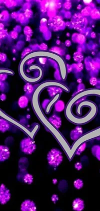 Get this stunning live wallpaper for your phone - featuring a beautiful purple heart design on a bold black background